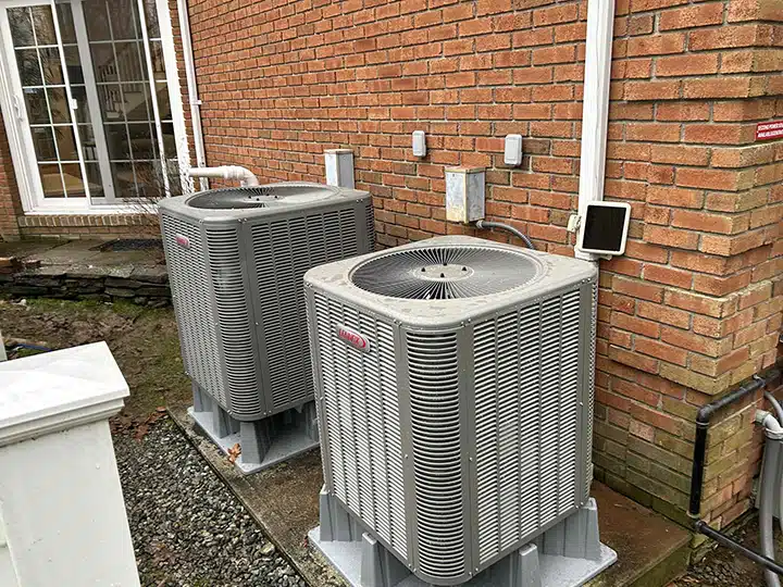 Air conditioners outside of residential home in Franklin Lakes NJ.